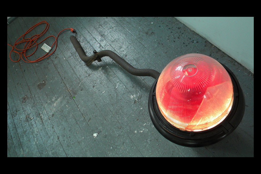 Lamp, found streetlight, tailpipe, extension cord, lightbulb, plastic; 2010